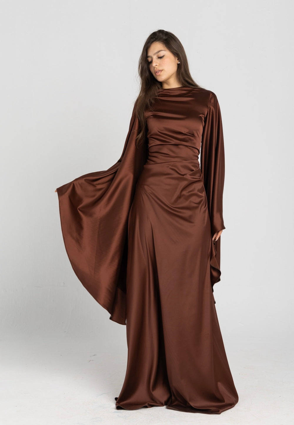 Sun Dress in Brown – floor-length satin maxi dress with flared sleeves and gathered waist
