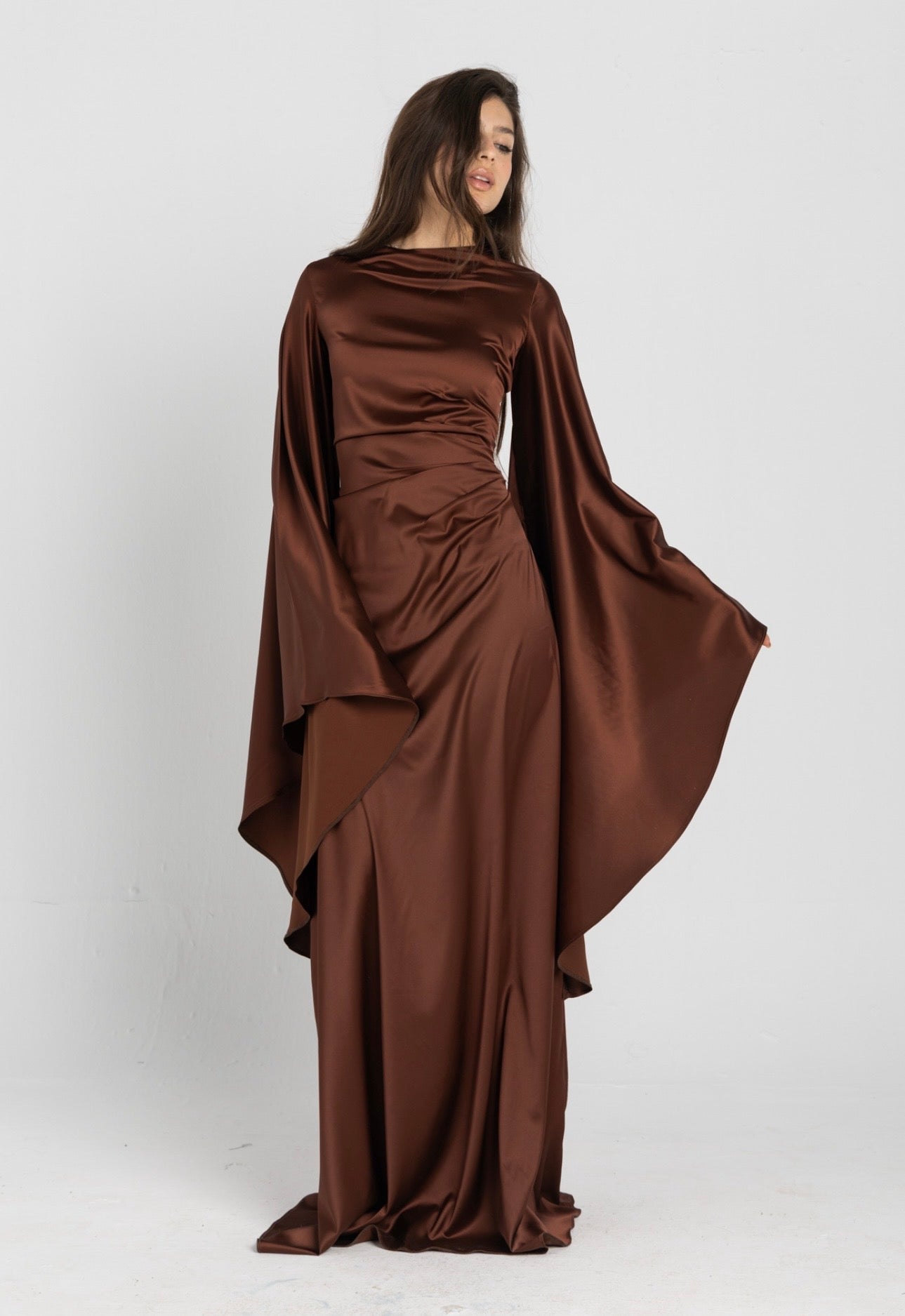 Sun Dress in Brown – floor-length satin maxi dress with flared sleeves and gathered waist
