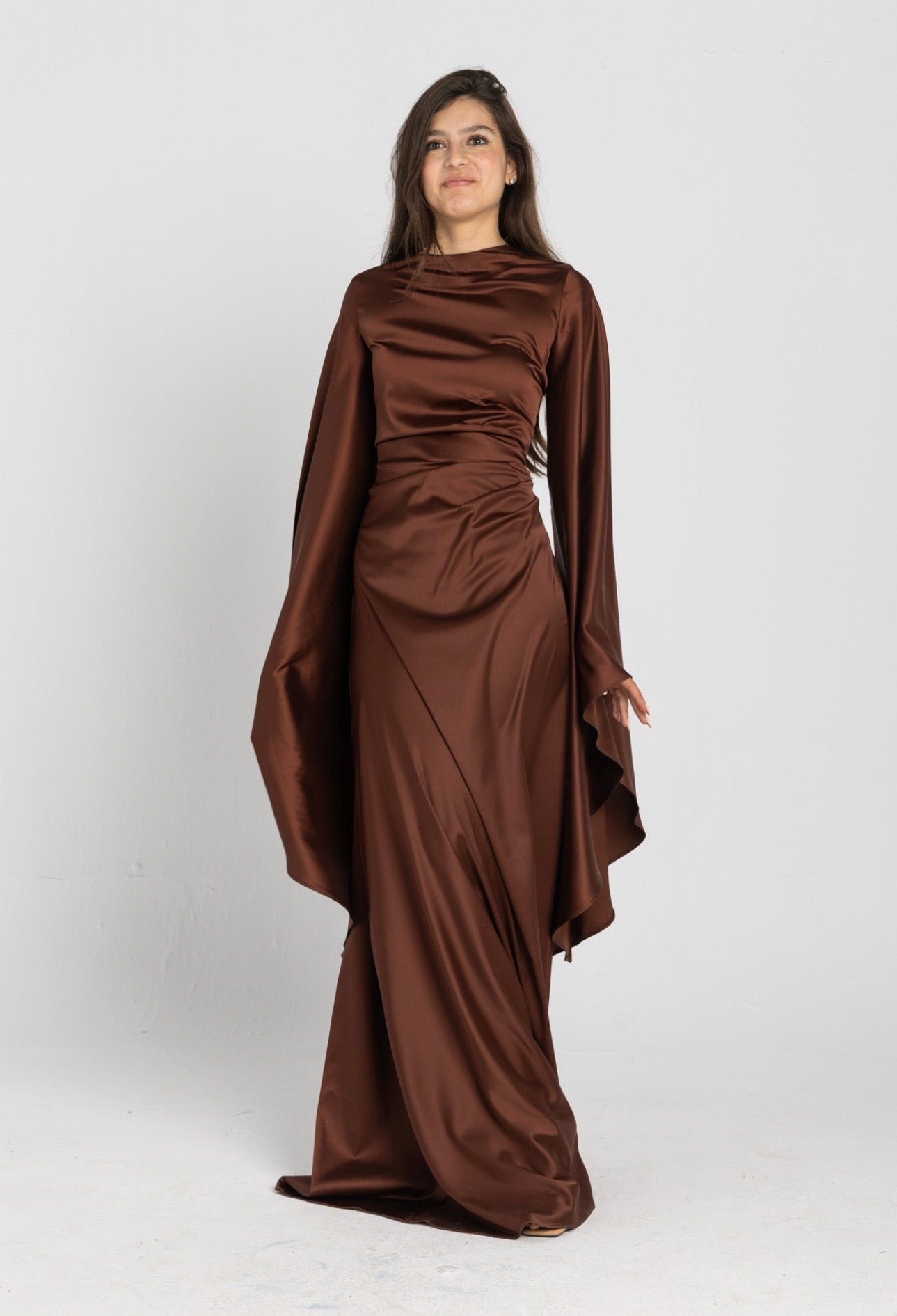 Sun Dress in Brown – floor-length satin maxi dress with flared sleeves and gathered waist
