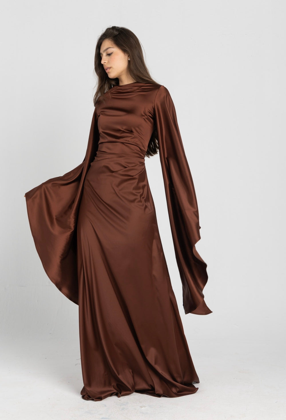 Sun Dress in Brown – floor-length satin maxi dress with flared sleeves and gathered waist
